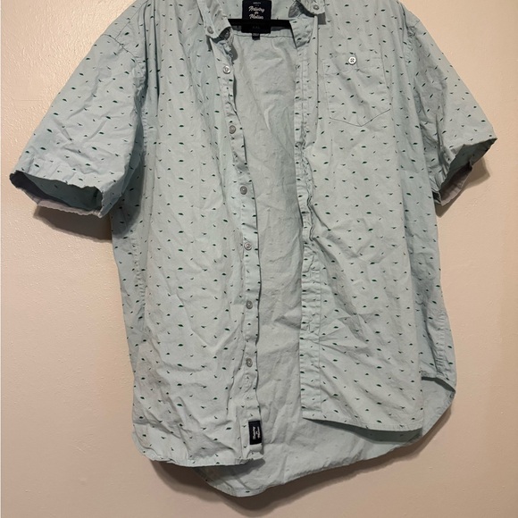 Artistry In Motion Light Blue with green dinosaurs Men's Shirt - Picture 1 of 3